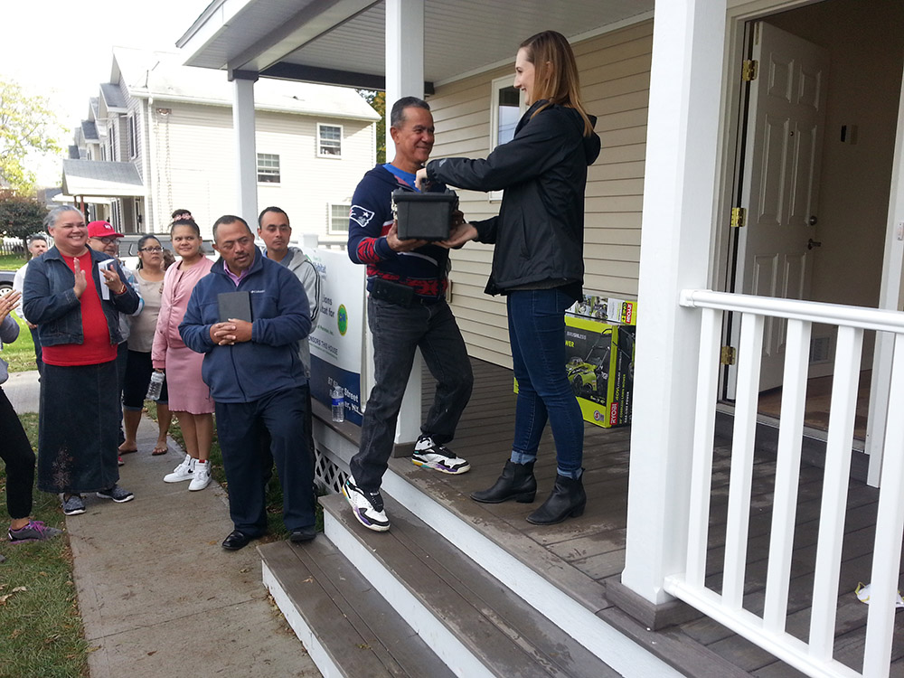 people on a porch receiving an award