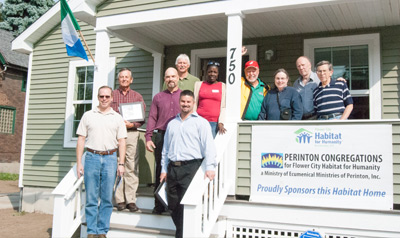 photo of team at a house grand opening